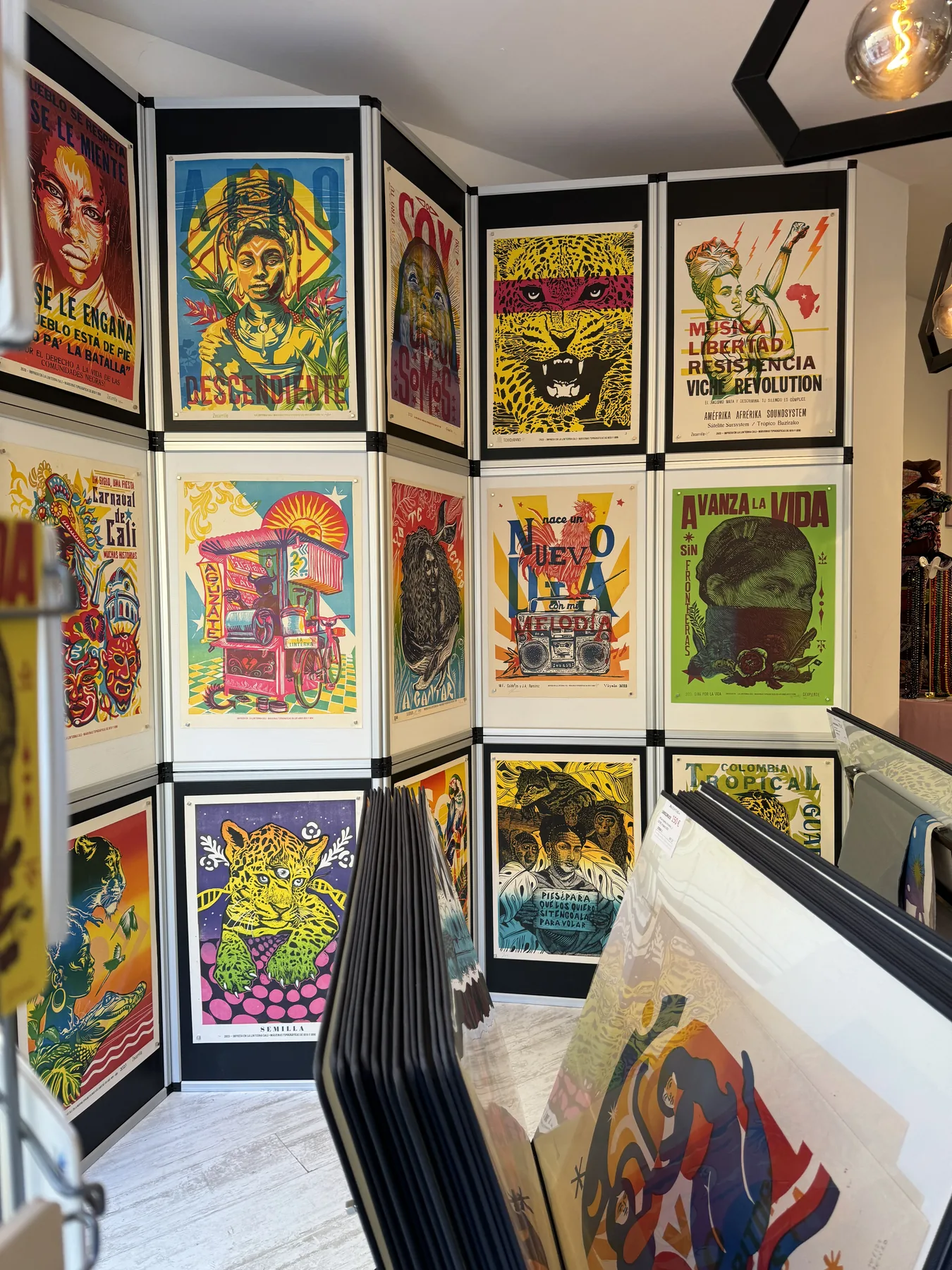 Corner gallery of bold Colombian screen-print posters in vivid primary colors